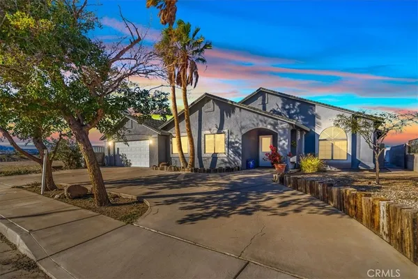 a front view of a house with yard