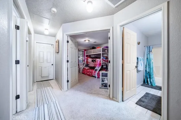 a bedroom with a bed and a desk