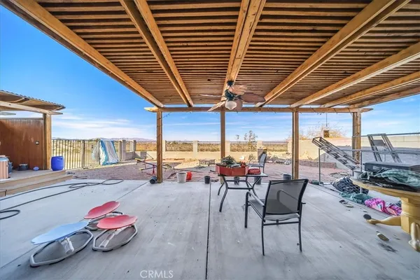 a view of a patio with swimming pool table and chairs