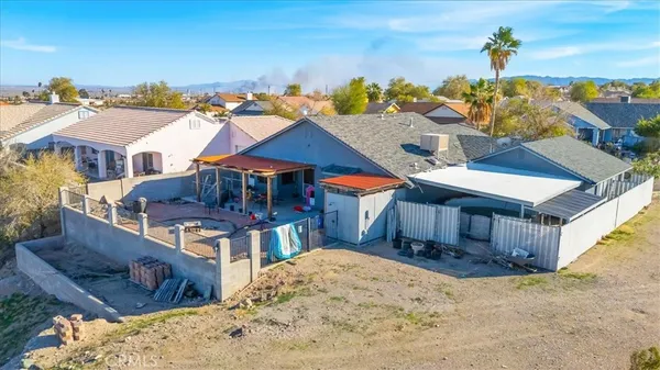 an aerial view of residential houses with outdoor space