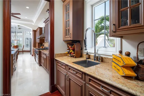a kitchen with sink and window