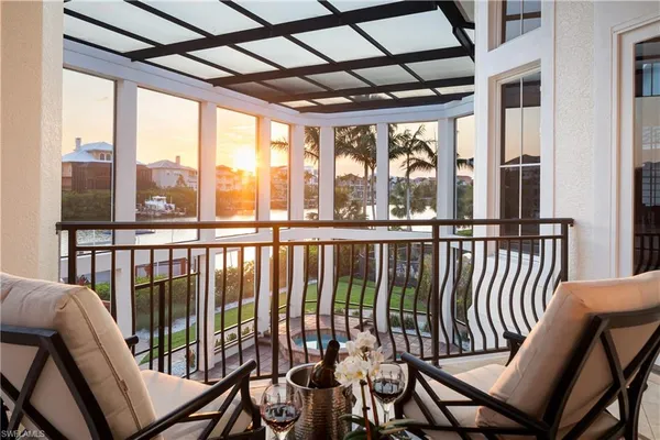 a view of a balcony with furniture