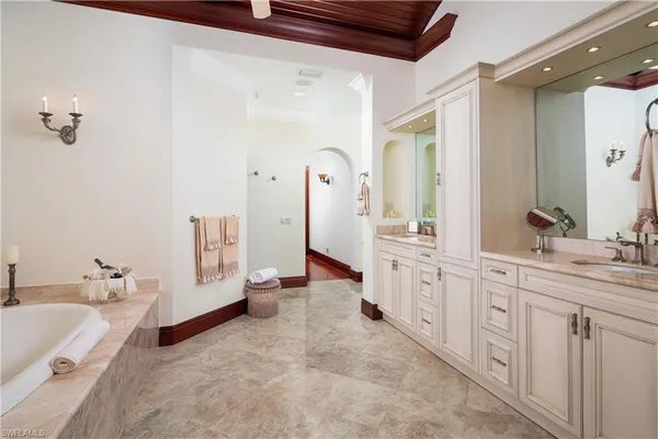 a bathroom with a granite countertop sink a toilet and shower