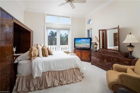 a bathroom with a granite countertop sink a toilet and a mirror