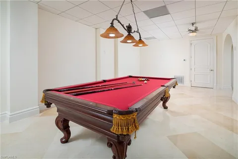 an aerial view of residential houses with outdoor space and lake view