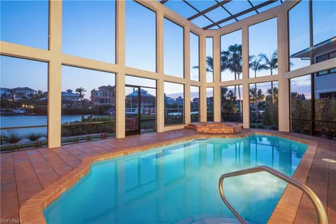 a view of a swimming pool with an outdoor seating