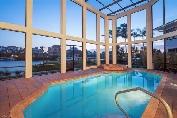 a view of a swimming pool with an outdoor seating