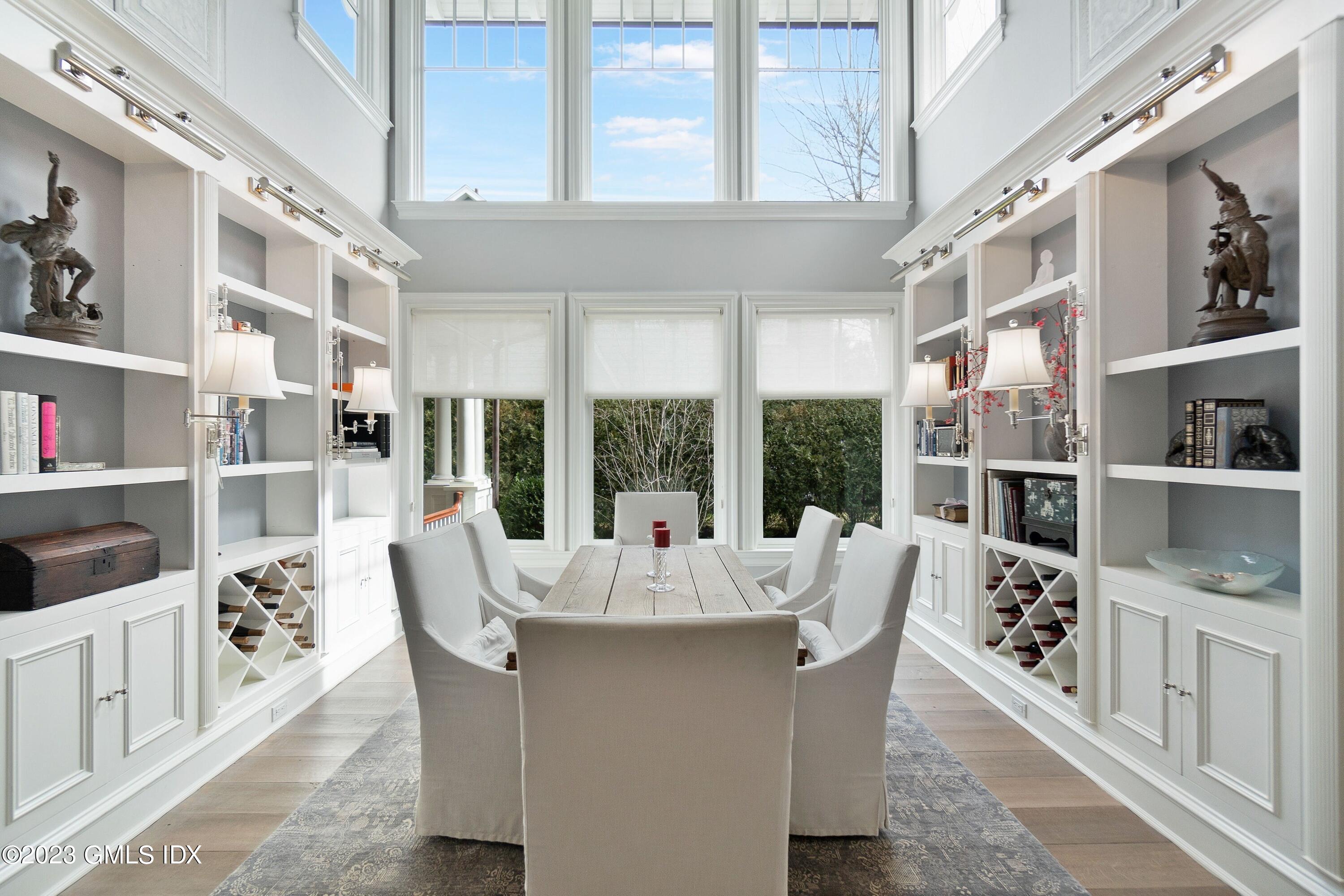 6 Cherry Lane Old Greenwich, CT 06870 - Photo 11 of 31 a dining room with furniture a rug and a large window