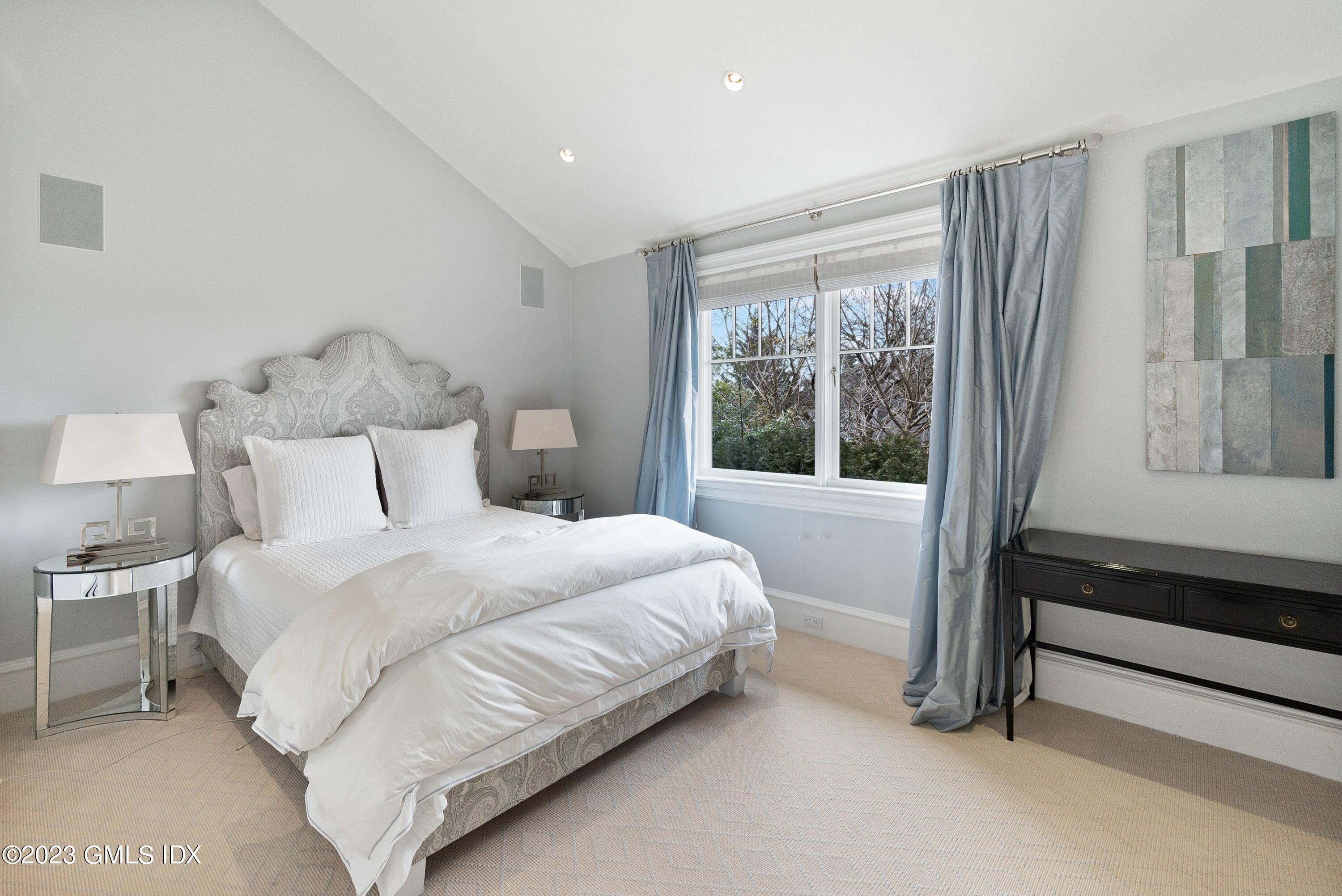 6 Cherry Lane Old Greenwich, CT 06870 - Photo 20 of 31 a bedroom with a bed and a window