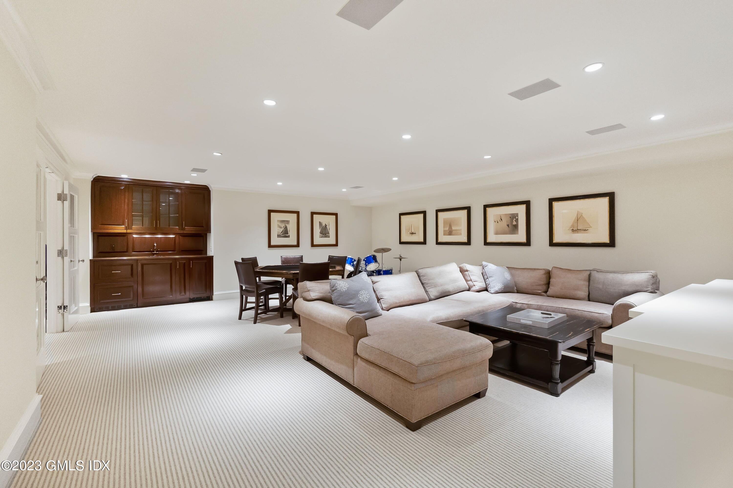 6 Cherry Lane Old Greenwich, CT 06870 - Photo 24 of 31 a living room with furniture and a flat screen tv