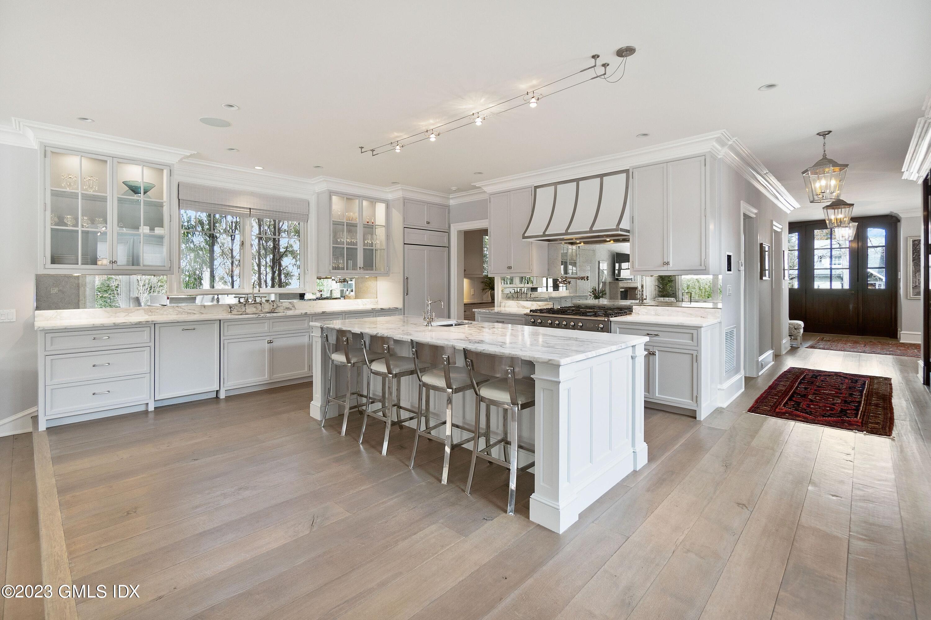 6 Cherry Lane Old Greenwich, CT 06870 - Photo 5 of 31 a kitchen with a sink stove cabinets and wooden floor