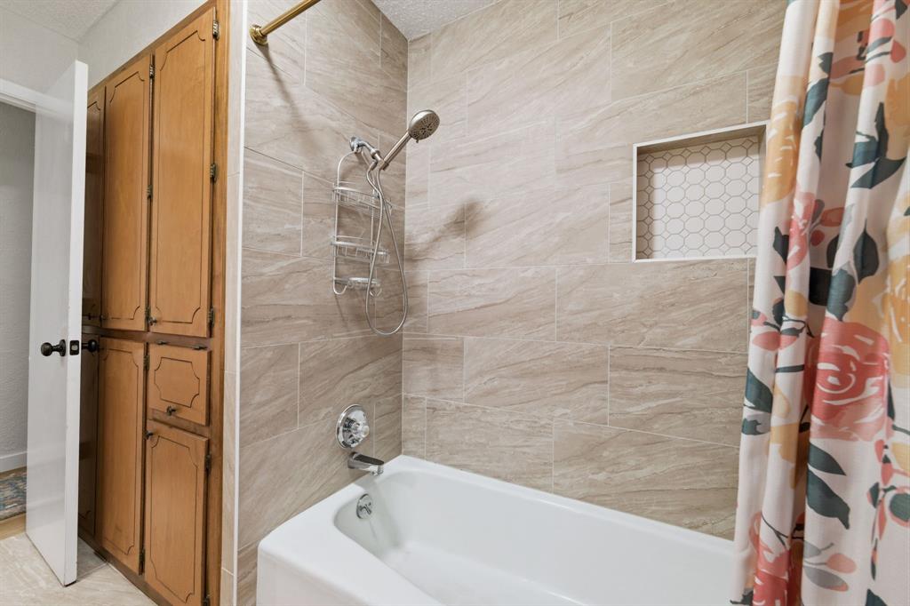 224 Overcrest Drive Benbrook, TX 76126 - Photo 25 of 39 a bathroom with a bathtub