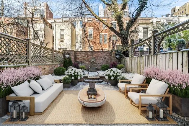 a view of a patio with couches and potted plants