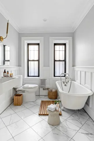 a kitchen with stainless steel appliances kitchen island granite countertop a refrigerator a stove and a sink