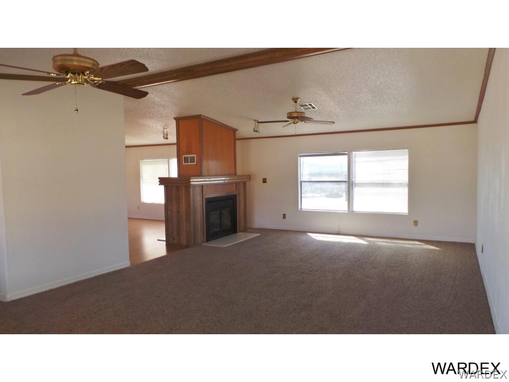 171 South Hano Road Golden Valley, AZ 86413 - Photo 3 of 20 a open kitchen with a stove and a refrigerator