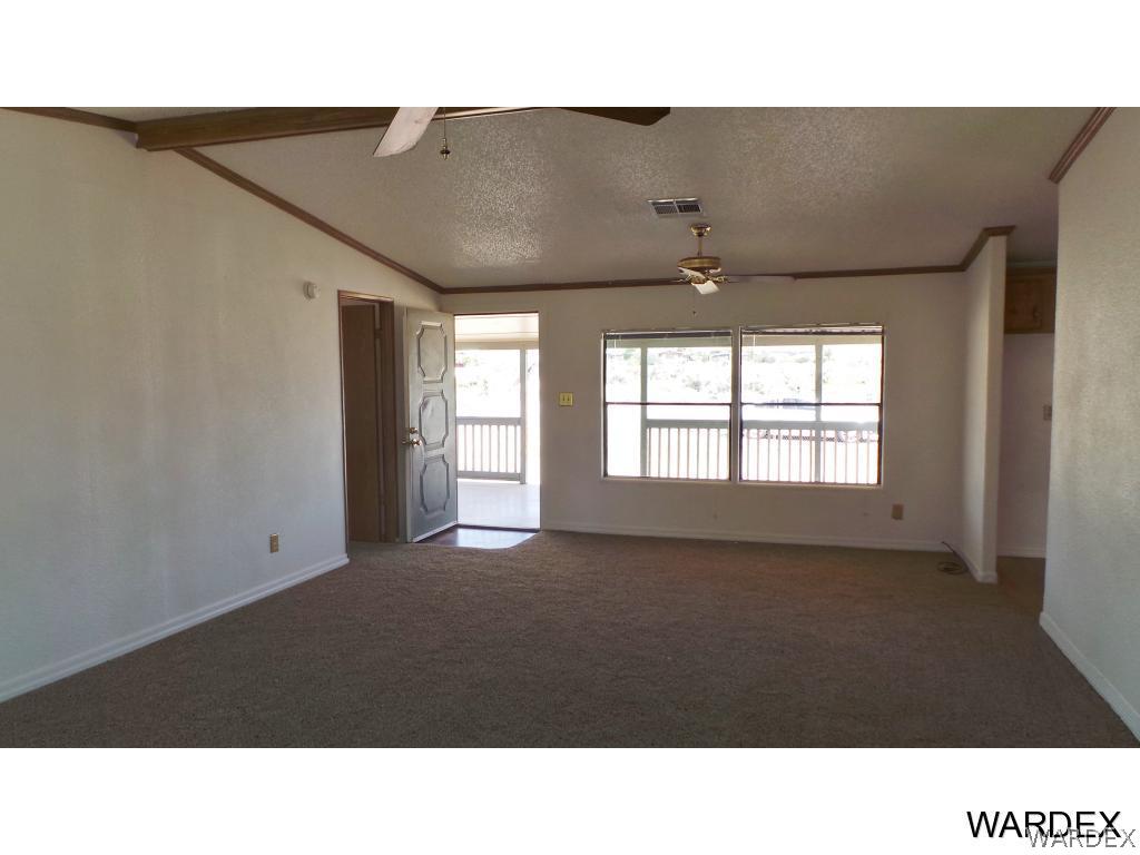 171 South Hano Road Golden Valley, AZ 86413 - Photo 8 of 20 a open hall with a floor to ceiling window