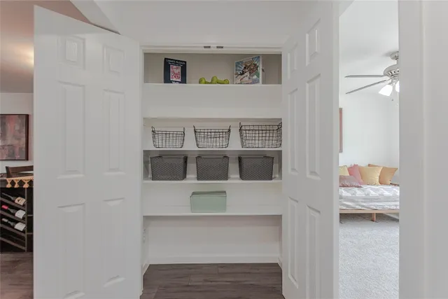 a living room with furniture and baby crib