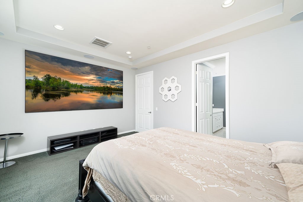 60 Visionary Irvine, CA 92618 - Photo 17 of 30 a bedroom with a bed and a flat screen tv