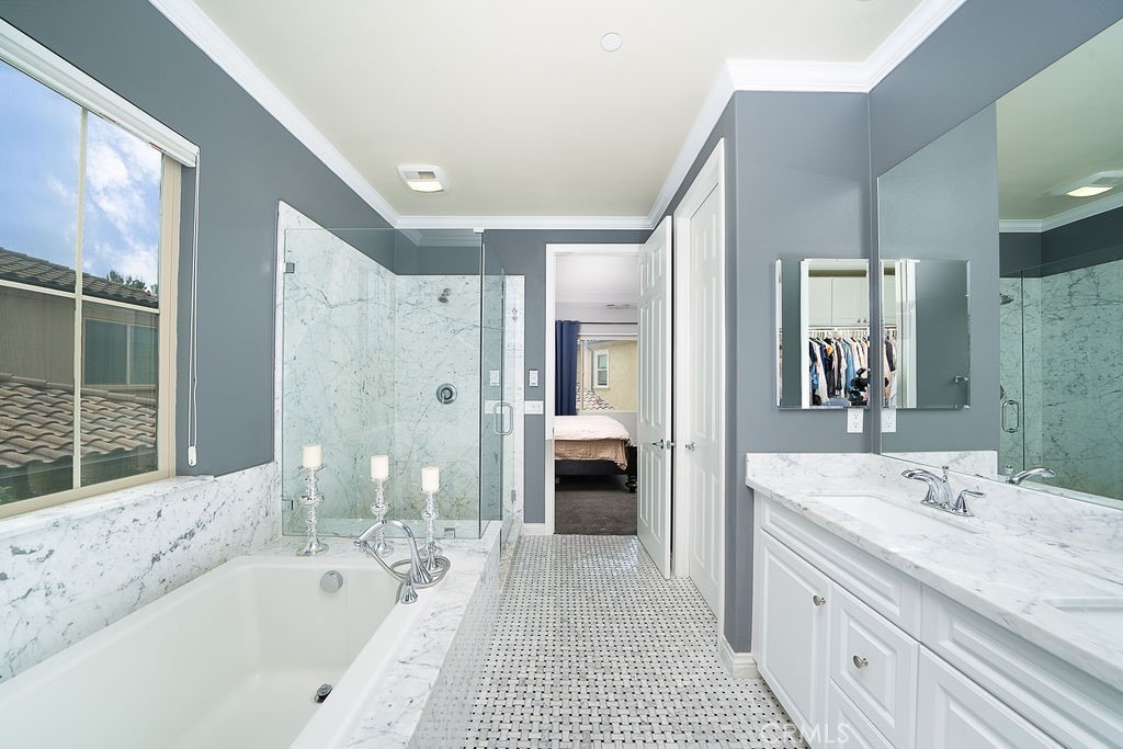 60 Visionary Irvine, CA 92618 - Photo 18 of 30 a spacious bathroom with a tub sink and mirror