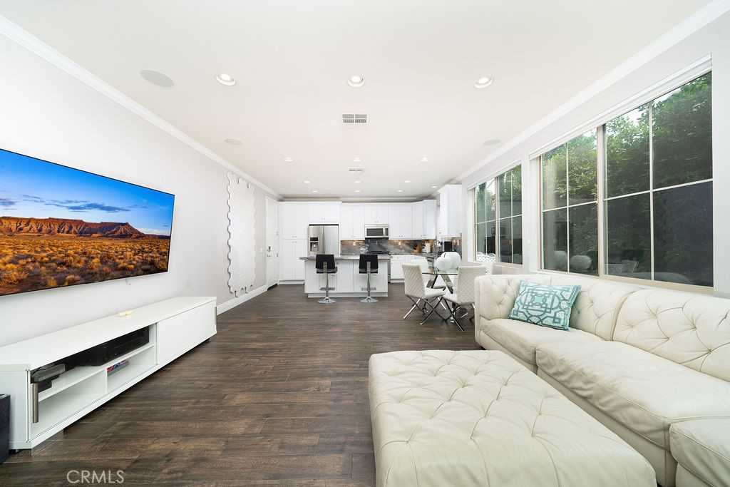 60 Visionary Irvine, CA 92618 - Photo 5 of 30 a living room with furniture flat screen tv and a large window