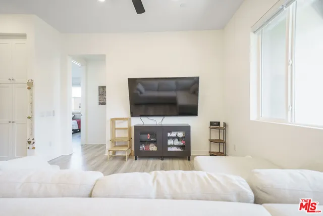 a living room with a large window and a table