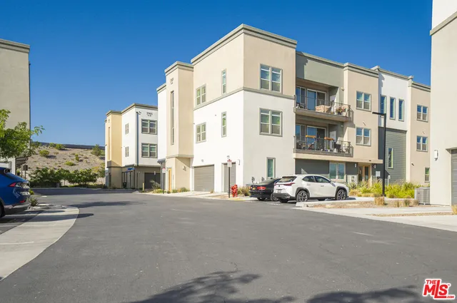 a view of a street with cars