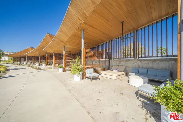 a view of a swimming pool with a lounge chair