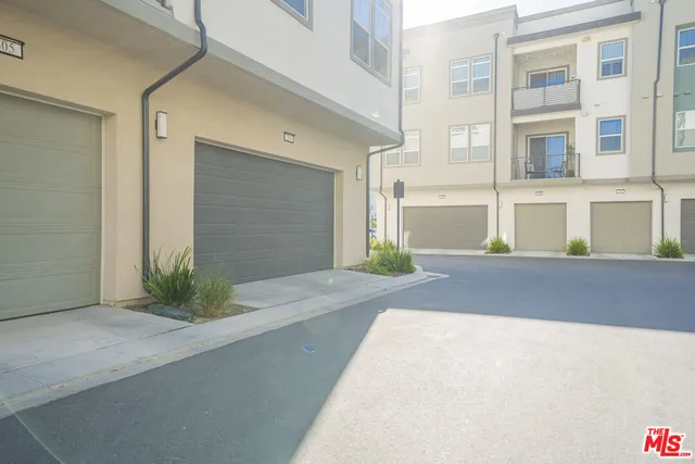 a view of an swimming pool with brick walls