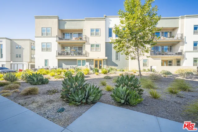 a view of multiple house with a swimming pool