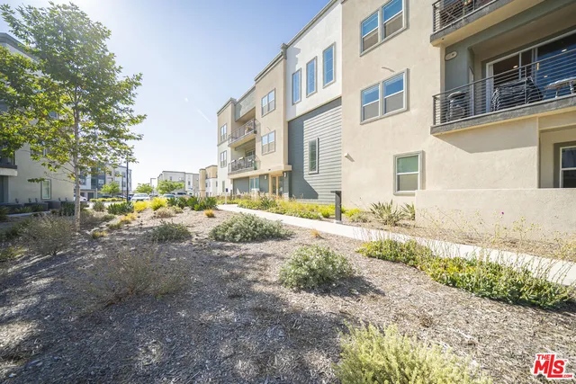 a swimming pool with outdoor seating and yard