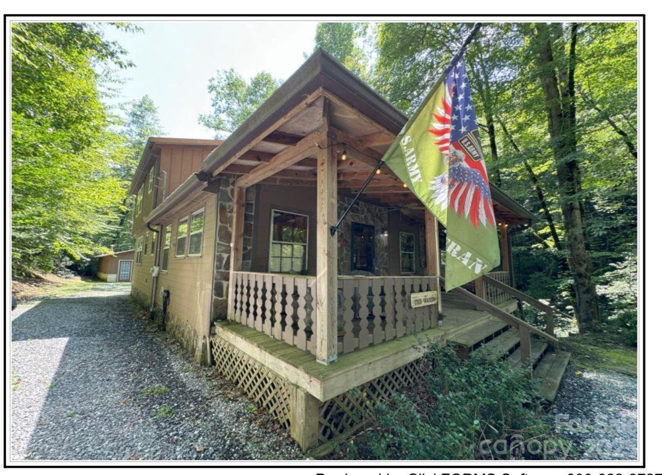 4700 West Buffalo Road Robbinsville, NC 28771 - Photo 13 of 25 a view of a house with a yard and deck