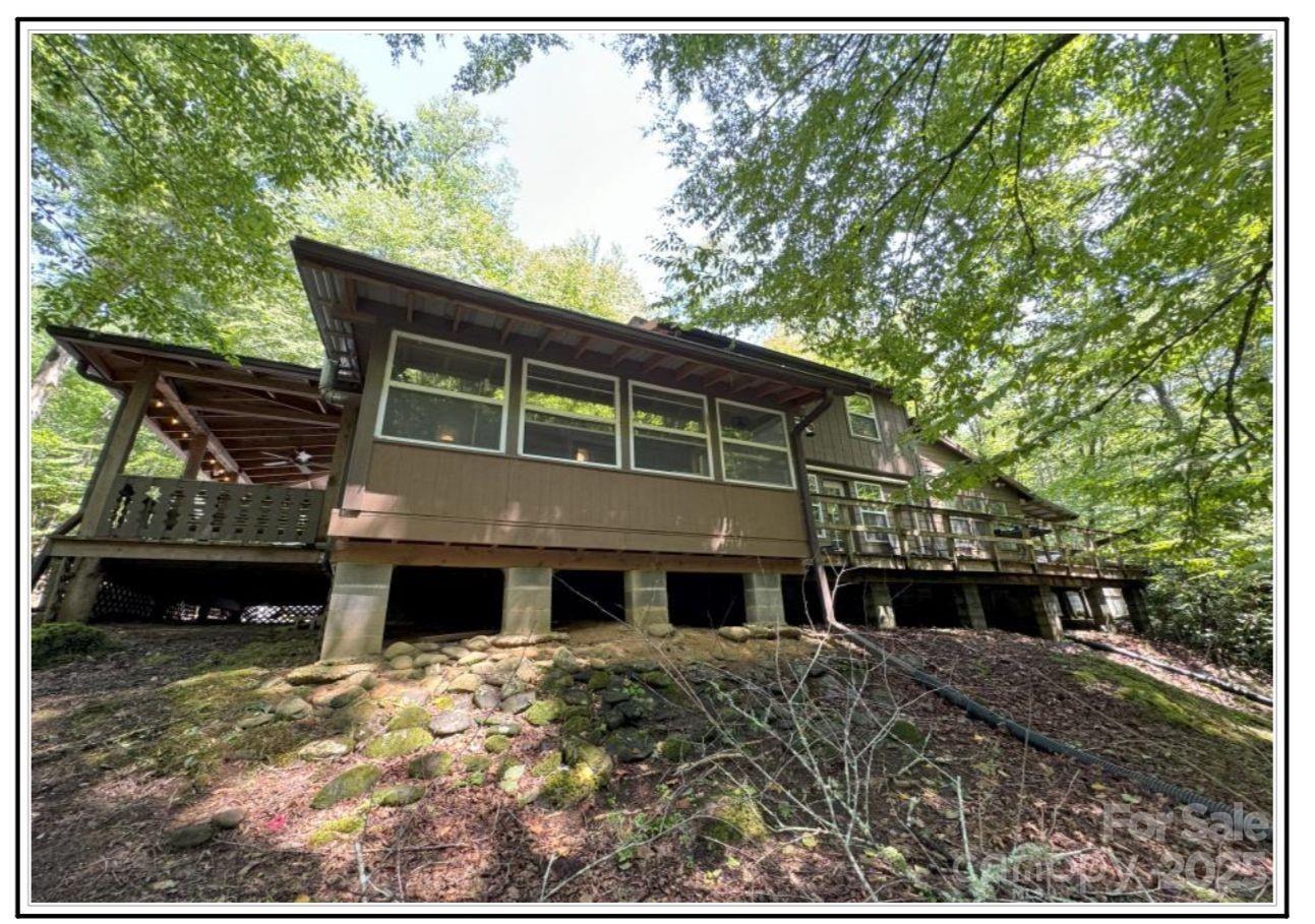 4700 West Buffalo Road Robbinsville, NC 28771 - Photo 14 of 25 a front view of a house with a yard
