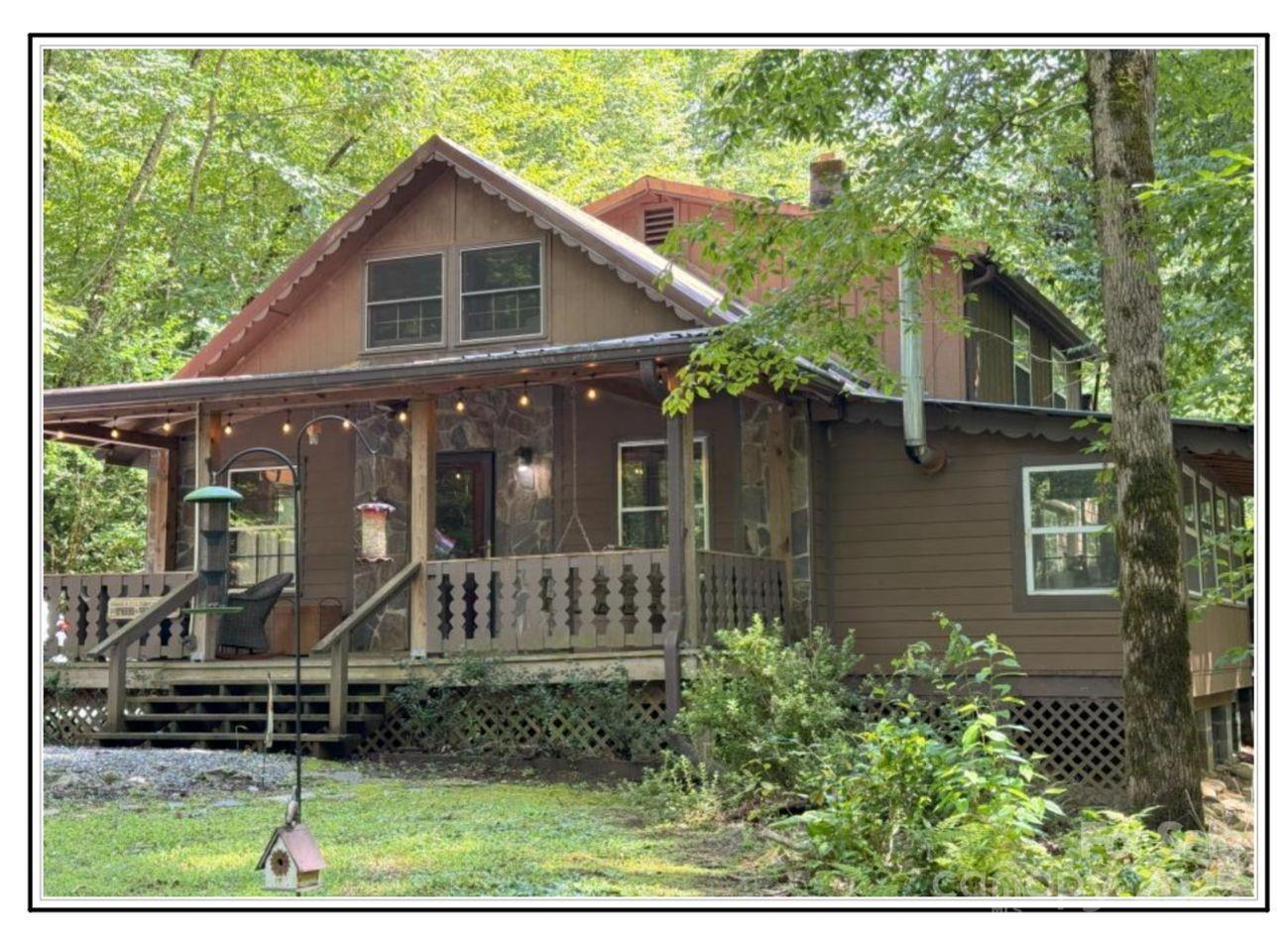4700 West Buffalo Road Robbinsville, NC 28771 - Photo 3 of 25 a front view of a house with garden