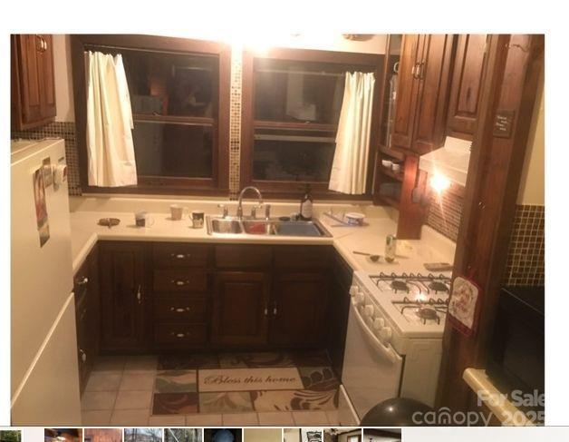 4700 West Buffalo Road Robbinsville, NC 28771 - Photo 5 of 25 a bathroom with a sink vanity and a mirror