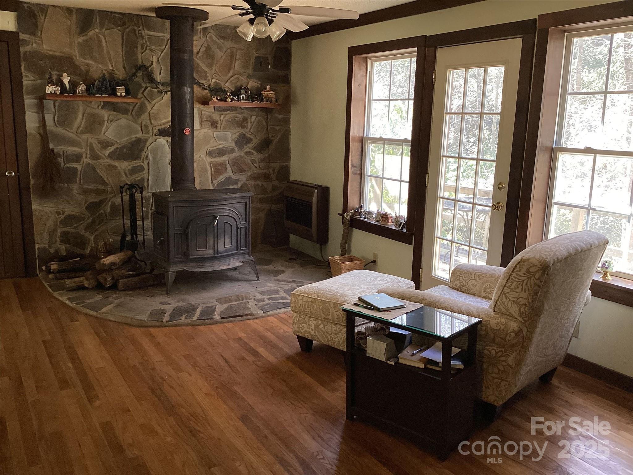 4700 West Buffalo Road Robbinsville, NC 28771 - Photo 8 of 25 a living room with furniture and a fireplace