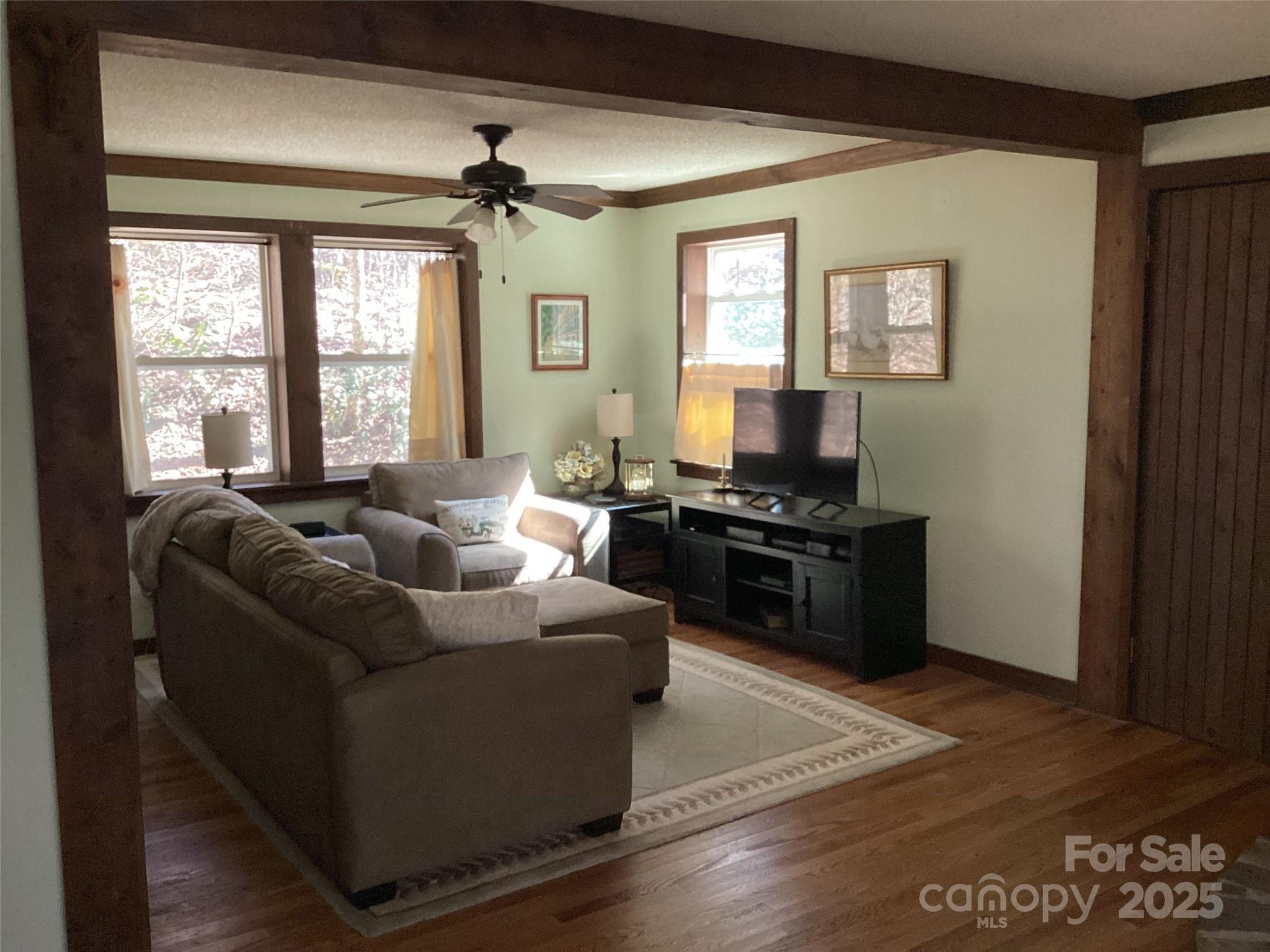4700 West Buffalo Road Robbinsville, NC 28771 - Photo 9 of 25 a living room with furniture and a fireplace