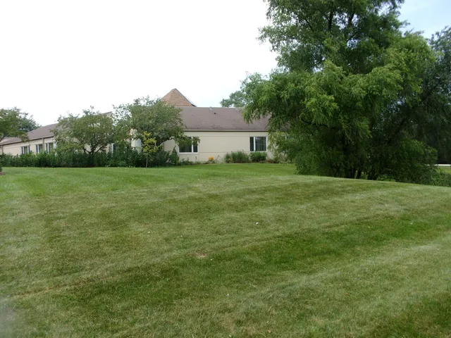 a backyard of a house with lots of green space