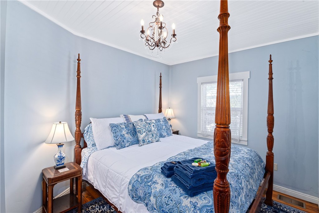 2013 3rd Street Julian, CA 92036 - Photo 12 of 32 a bed room with a bed window and a table