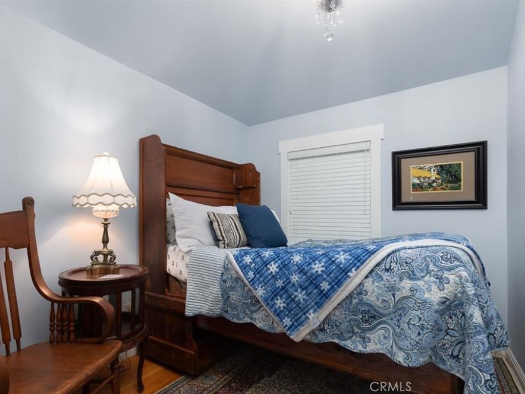 2013 3rd Street Julian, CA 92036 - Photo 14 of 32 a bedroom with a bed and lamp on dresser