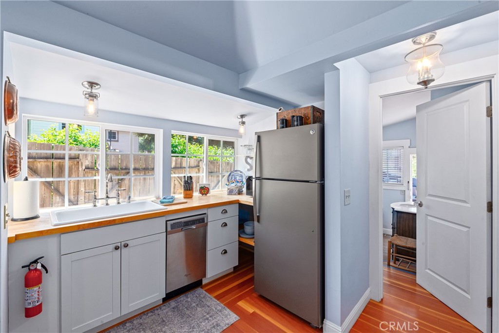 2013 3rd Street Julian, CA 92036 - Photo 4 of 32 a kitchen with white cabinets and refrigerator