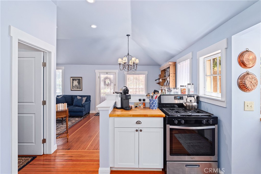 2013 3rd Street Julian, CA 92036 - Photo 5 of 32 a kitchen that has a stove and a wooden floor