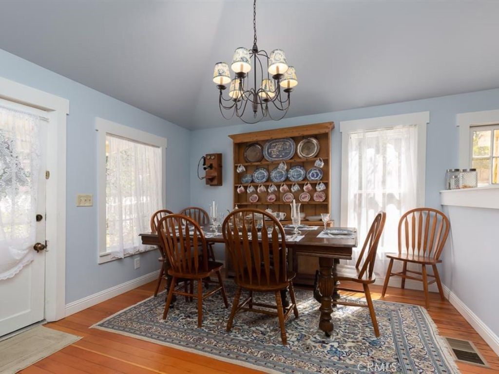 2013 3rd Street Julian, CA 92036 - Photo 10 of 32 a view of a dining room with furniture window and wooden floor