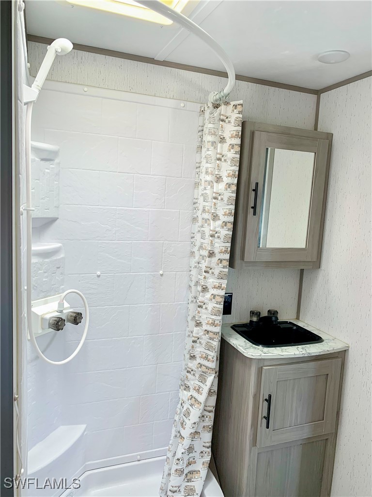 19681 Summerlin Road, Unit 23 Fort Myers, FL 33908 - Photo 14 of 24 a bathroom with a bathtub and shower