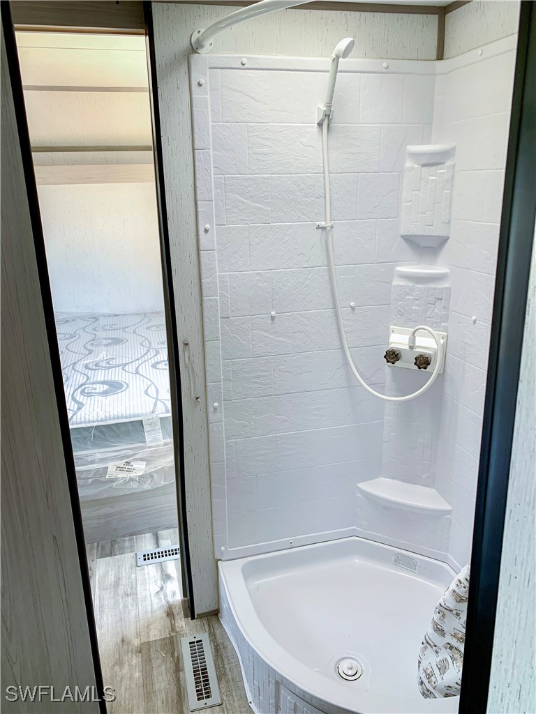 19681 Summerlin Road, Unit 23 Fort Myers, FL 33908 - Photo 15 of 24 a bathroom with a bathtub and a shower