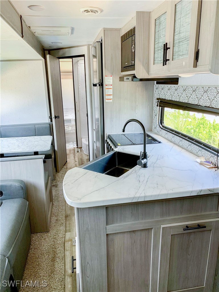 19681 Summerlin Road, Unit 23 Fort Myers, FL 33908 - Photo 9 of 24 a close view of sink and tap