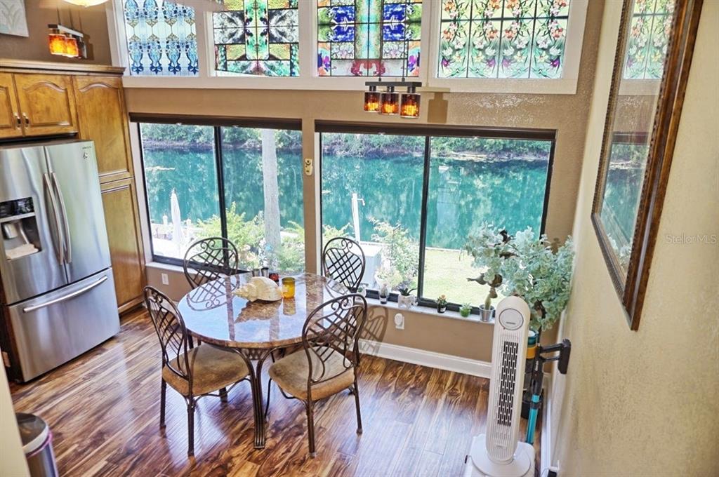 1873 Mazo Manor Road, Unit 5 Lutz, FL 33558 - Photo 12 of 41 a view of a dining room with furniture window and wooden floor