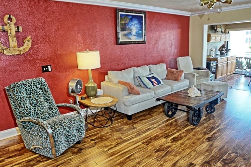 1873 Mazo Manor Road, Unit 5 Lutz, FL 33558 - Photo 2 of 41 a living room with furniture and a wooden floor