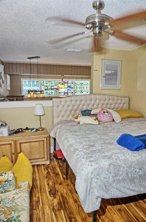 1873 Mazo Manor Road, Unit 5 Lutz, FL 33558 - Photo 30 of 41 a bedroom with a bed and a window