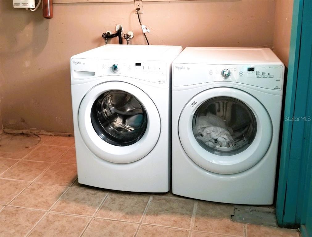 1873 Mazo Manor Road, Unit 5 Lutz, FL 33558 - Photo 33 of 41 a utility room with dryer and washer