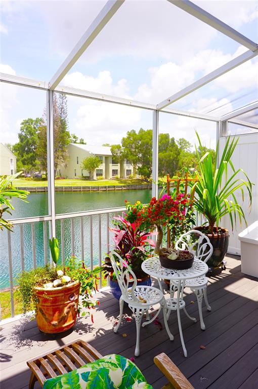 1873 Mazo Manor Road, Unit 5 Lutz, FL 33558 - Photo 36 of 41 a outdoor dining space with furniture and garden view